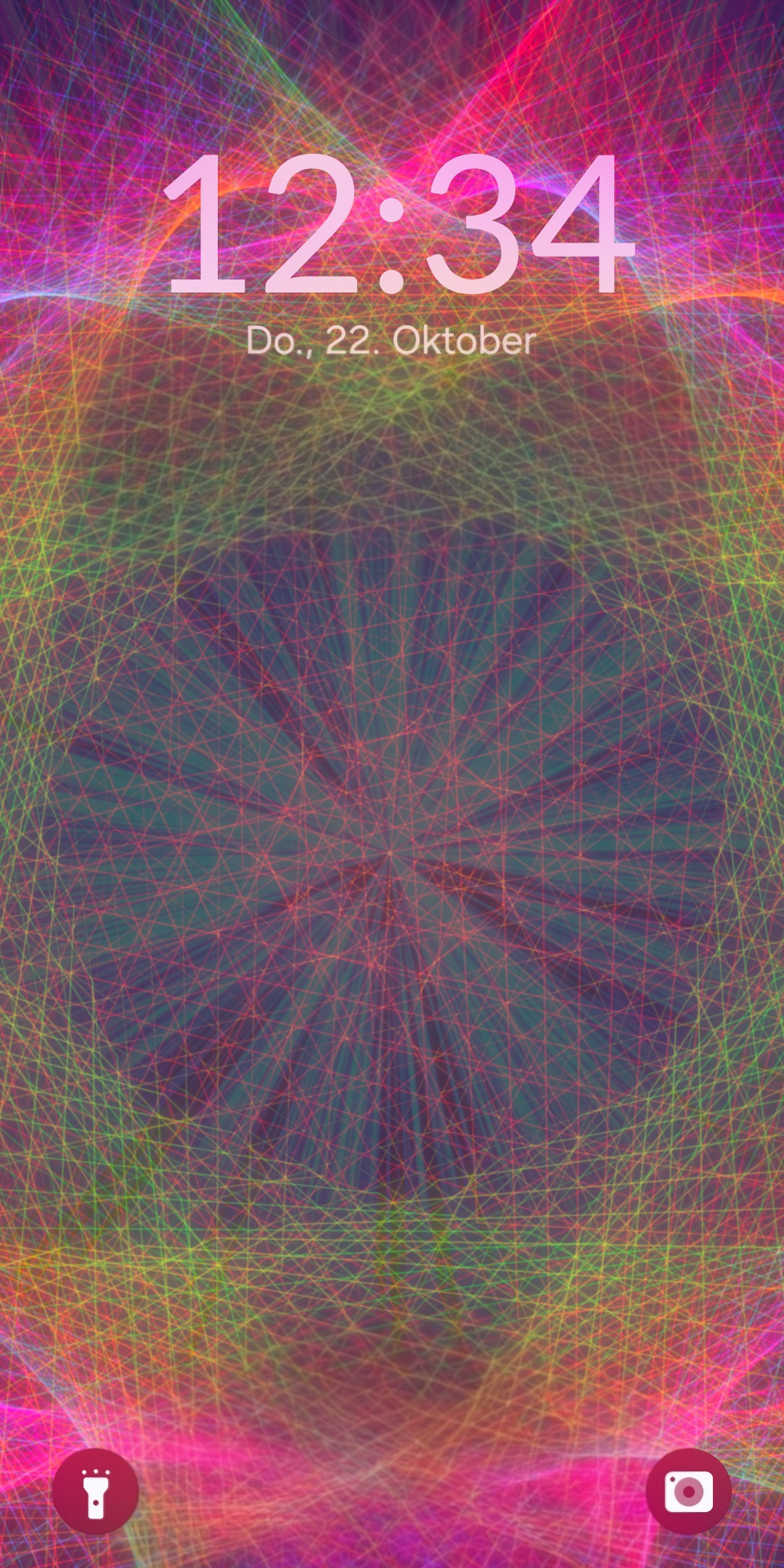 A lock screen with a mandala wallpaper behind the clock